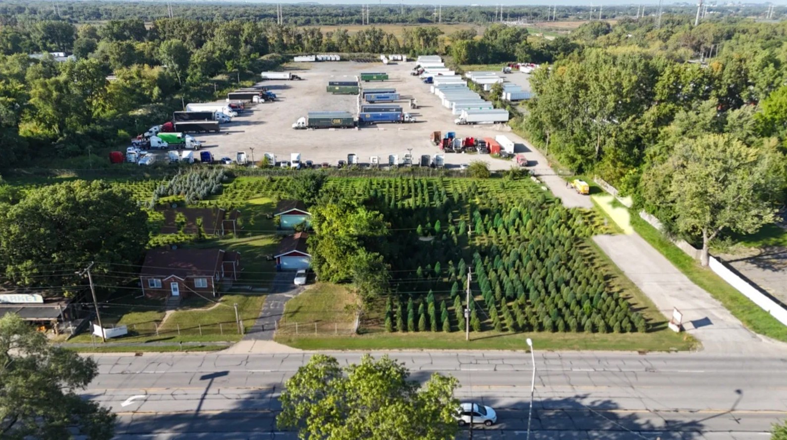 Aerial view of the Gary Truck Park lot from Ridge Road, with tractors and trailers parked in rows inside the fenced yard